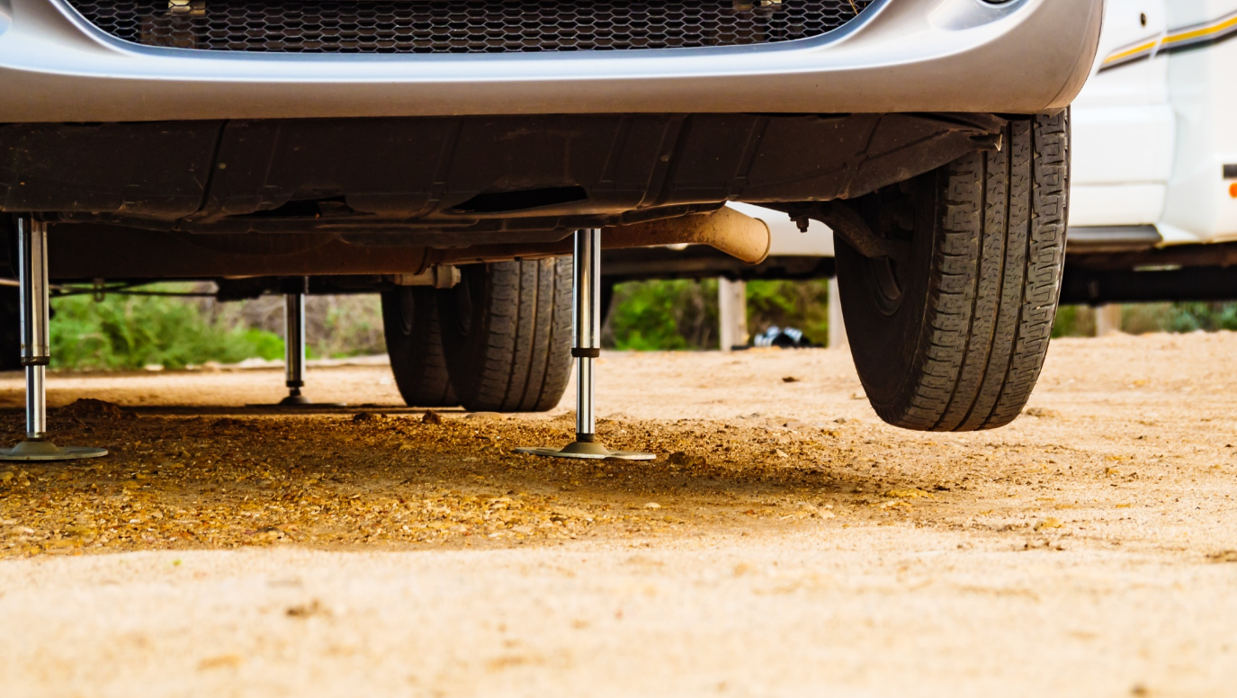 RV technician diagnosing a leveling system on a fifth wheel